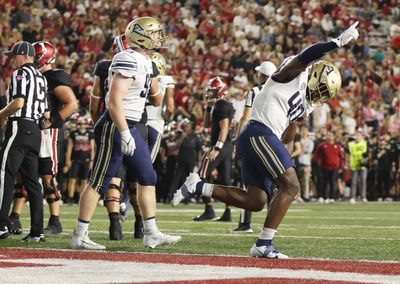 Akron Zips linebacker Bryan McCoy (40) celebrates after...